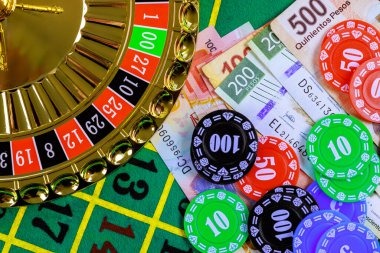 Roulette wheel spin Roulette wheel with ball in motion and betting layout visible